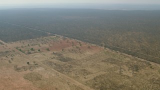 HD stock footage aerial video of an approach to open savanna, Zimbabwe Aerial Stock Footage | CAP_026_016