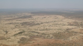 HD stock footage aerial video of flying by open savanna, Zimbabwe Aerial Stock Footage | CAP_026_018