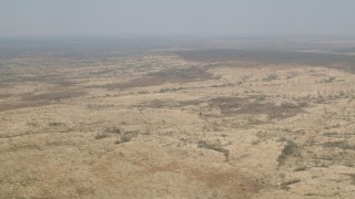 HD stock footage aerial video of passing by open savanna, Zimbabwe Aerial Stock Footage | CAP_026_019