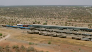 HD stock footage aerial video of flying by trains at a train station, Zimbabwe Aerial Stock Footage | CAP_026_072