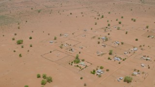 HD stock footage aerial video of flying over houses on the outskirts of a village in Zimbabwe Aerial Stock Footage | CAP_026_106