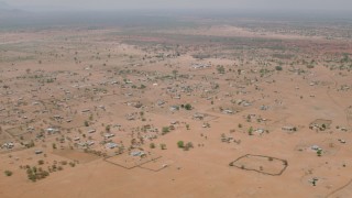 CAP_026_110 - HD stock footage aerial video of passing by an African village in Zimbabwe