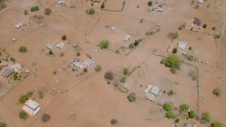 CAP_026_116 - HD stock footage aerial video of a bird's eye view of houses in an African village, Zimbabwe