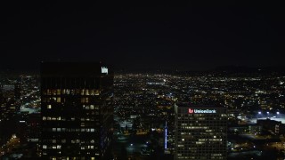 DCA01_018 - 5K aerial stock footage flying between Paul Hastings Tower and Union Bank Plaza toward Hollywood city lights at night, Los Angeles, California