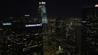 DCA01_025 - 5K aerial stock footage flying by skyscrapers revealing Los Angeles City Hall at night, California