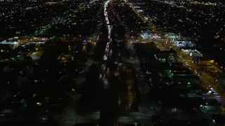 DCA01_061 - 5K aerial stock footage following Highway 110 in Los Angeles at night, California