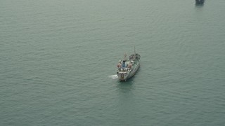 4K aerial stock footage of a cargo ship on the South China Sea near the Outlying Islands, Hong Kong, China Aerial Stock Footage | DCA02_008