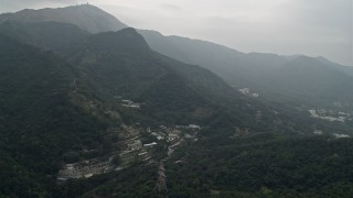 4K aerial stock footage of botanical garden at the base of mountains in the New Territories, Hong Kong, China Aerial Stock Footage | DCA02_029