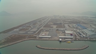 4K aerial stock footage of maintenance buildings and runways at Hong Kong International Airport, Hong Kong, China Aerial Stock Footage | DCA02_049