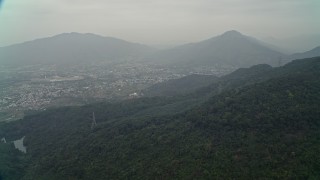 4K aerial stock footage of Shek Kong neighborhoods and mountain peaks, New Territories, Hong Kong, China Aerial Stock Footage | DCA02_069E