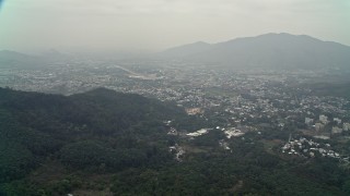 4K aerial stock footage of Shek Kong neighborhoods and mountain peak in New Territories, Hong Kong, China Aerial Stock Footage | DCA02_071