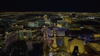 DCA03_018 - 4K aerial stock footage of Las Vegas Boulevard past Planet Hollywood to Flamingo and Caesar's Palace, Las Vegas, Nevada Night