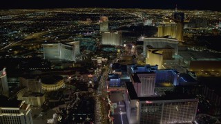 DCA03_019 - 4K aerial stock footage of Las Vegas Boulevard between Caesar's Palace and Flamingo, toward The Mirage and Treasure Island, Las Vegas, Nevada Night