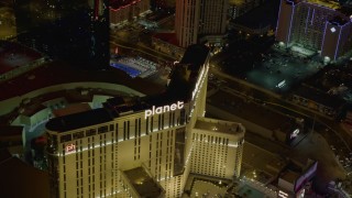 DCA03_044 - 4K aerial stock footage of orbiting Planet Hollywood and street with traffic, Las Vegas, Nevada Night