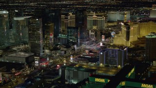 4K aerial stock footage of flying toward Planet Hollywood, following Las Vegas Blvd, Las Vegas, Nevada Night Aerial Stock Footage | DCA03_058