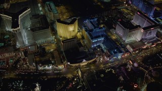 DCA03_069 - 4K aerial stock footage of flying by The Venetian, Harrah's, Imperial Palace, Las Vegas, Nevada Night