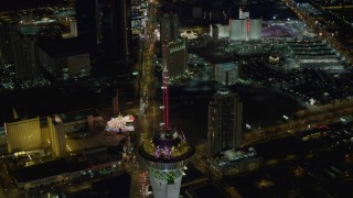 4K aerial stock footage of orbiting Stratosphere, revealing Las Vegas Boulevard, hotels on Strip, Las Vegas, Nevada Night Aerial Stock Footage | DCA03_084