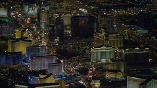 4K aerial stock footage tilt up on Las Vegas Boulevard, revealing hotels on Las Vegas Strip, Nevada Night Aerial Stock Footage | DCA03_123