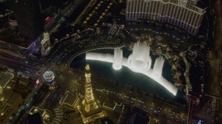 4K aerial stock footage of orbiting The Bellagio fountain at the end of the show, Las Vegas, Nevada Night Aerial Stock Footage | DCA03_134