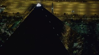 DCA03_161 - 4K aerial stock footage of orbiting the top of Luxor Hotel and Casino, Las Vegas, Nevada Night