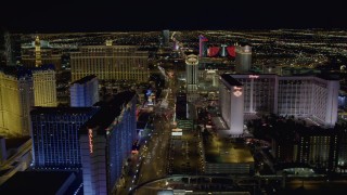 4K aerial stock footage of flying behind Bally's and Flamingo, Las Vegas, Nevada Aerial Stock Footage | DCA03_169