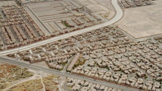 DCA04_004 - 4K aerial stock footage zooming in on suburban neighborhood in East Las Vegas, Nevada