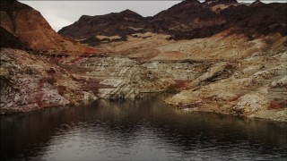 DCA04_067 - 4K aerial stock footage of flying over desert dunes on shore of Lake Mead, Nevada