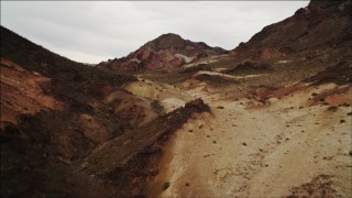 DCA04_070 - 4K aerial stock footage of flying over desert dunes toward Hiller Mountains, Nevada