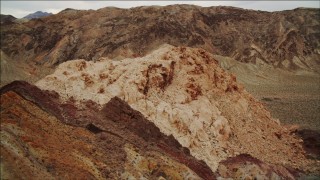 4K aerial stock footage of flying by a small mountain in Hiller Mountains, Nevada Aerial Stock Footage | DCA04_079