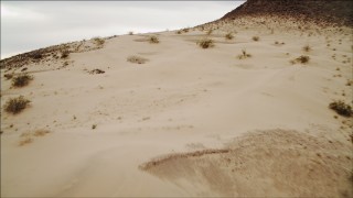 4K aerial stock footage of flying over sandy dunes near Lake Mead, Nevada Aerial Stock Footage | DCA04_089