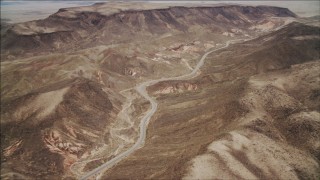 4K aerial stock footage of following a winding road in the Nevada Desert, Nevada Aerial Stock Footage | DCA04_095