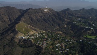 DCA05_004 - 4K aerial stock footage of flying over Hollywood Hills, approaching Hollywood Sign, Los Angeles, California