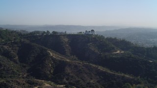 4K aerial stock footage pan across Hollywood Hills, revealing Griffith Observatory, Los Angeles, California Aerial Stock Footage | DCA05_011