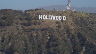 DCA05_021 - 4K aerial stock footage tilt from the Hollywood Reservoir, revealing Hollywood Sign, Los Angeles, California