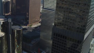 DCA05_036 - 4K aerial stock footage of Paul Hastings Tower, Los Angeles Public Library, Downtown Los Angeles, California