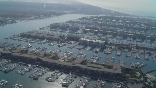 4K aerial stock footage of flying over the marina, tilt down on boats, Marina Del Rey, California Aerial Stock Footage | DCA05_064