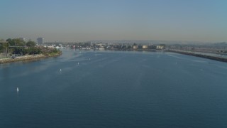 DCA05_067 - 4K aerial stock footage of flying by the mouth of the marina and homes, Marina Del Rey, California