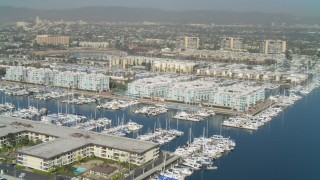 4K aerial stock footage pan to boats in the marina and waterfront apartments, Marina Del Rey, California Aerial Stock Footage | DCA05_069