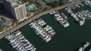 DCA05_072 - 4K aerial stock footage pan across boat in the marina; Marina Del Rey, California 