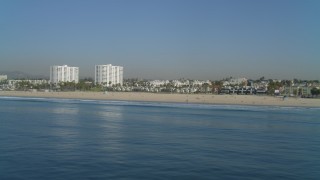 4K aerial stock footage of flying by Santa Monica State Beach, beachfront apartments, Santa Monica, California Aerial Stock Footage | DCA05_078