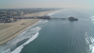 4K aerial stock footage of flying away from the Santa Monica Pier, Santa Monica, California Aerial Stock Footage | DCA05_083