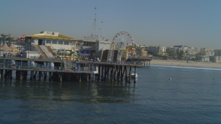 4K aerial stock footage of flying low over ocean, end of the Santa Monica Pier, Santa Monica, California Aerial Stock Footage | DCA05_092