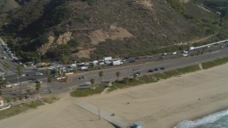 4K aerial stock footage of flying by Highway 1 near the coast, Pacific Palisades, California Aerial Stock Footage | DCA05_097