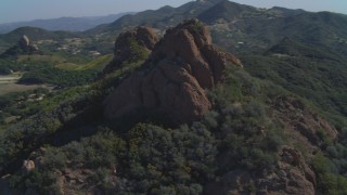 4K aerial stock footage of orbiting a hilltop rock formation, Malibu, California Aerial Stock Footage | DCA05_133