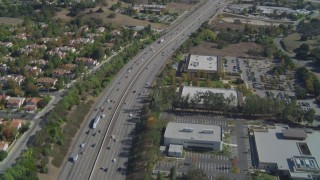 DCA05_149 - 4K aerial stock footage of flying over Highway 101, tilt up, Agoura Hills, California