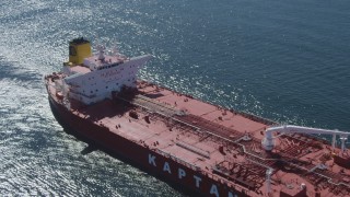 DCA06_033 - 4K aerial stock footage fly over oil tanker sailing the ocean near Long Beach, California