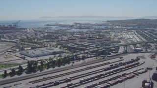 4K aerial stock footage flyby cargo containers, reveal bridge at Port of Los Angeles, San Pedro, California Aerial Stock Footage | DCA06_043