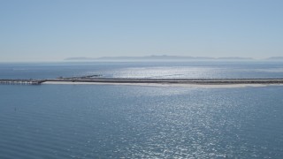 4K aerial stock footage of panning across a breakwater, reveal Cabrillo Beach, San Pedro, California Aerial Stock Footage | DCA06_047