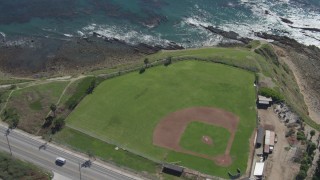 DCA06_049 - 4K aerial stock footage flyby coastal road revealing Mary Star Fromhold Baseball Field, San Pedro, California