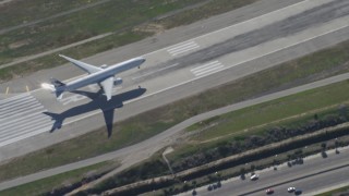 DCA06_062 - 4K aerial stock footage of a cargo jet landing at LAX (Los Angeles International Airport), Los Angeles, California